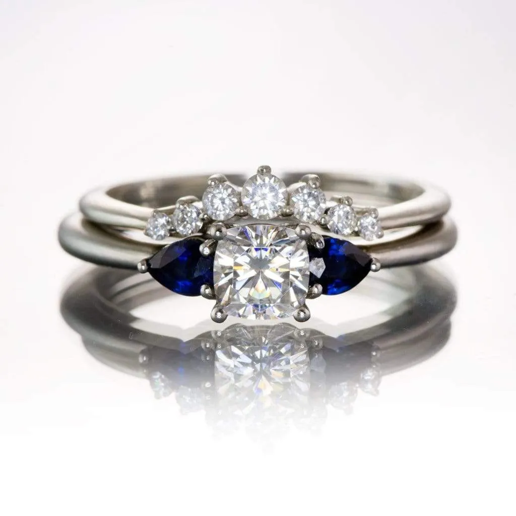 Tressa- Three Stone Engagement Ring, Prong set Cushion Moissanite & Pear Blue Sapphire Accents