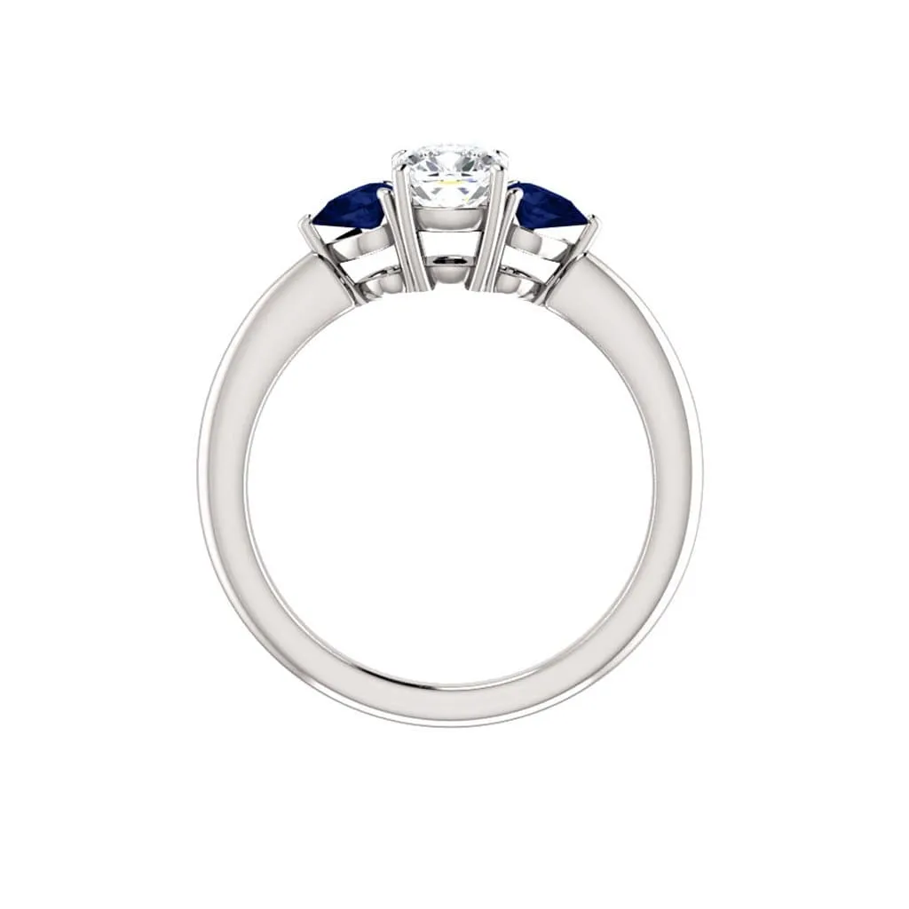 Tressa- Three Stone Engagement Ring, Prong set Cushion Moissanite & Pear Blue Sapphire Accents