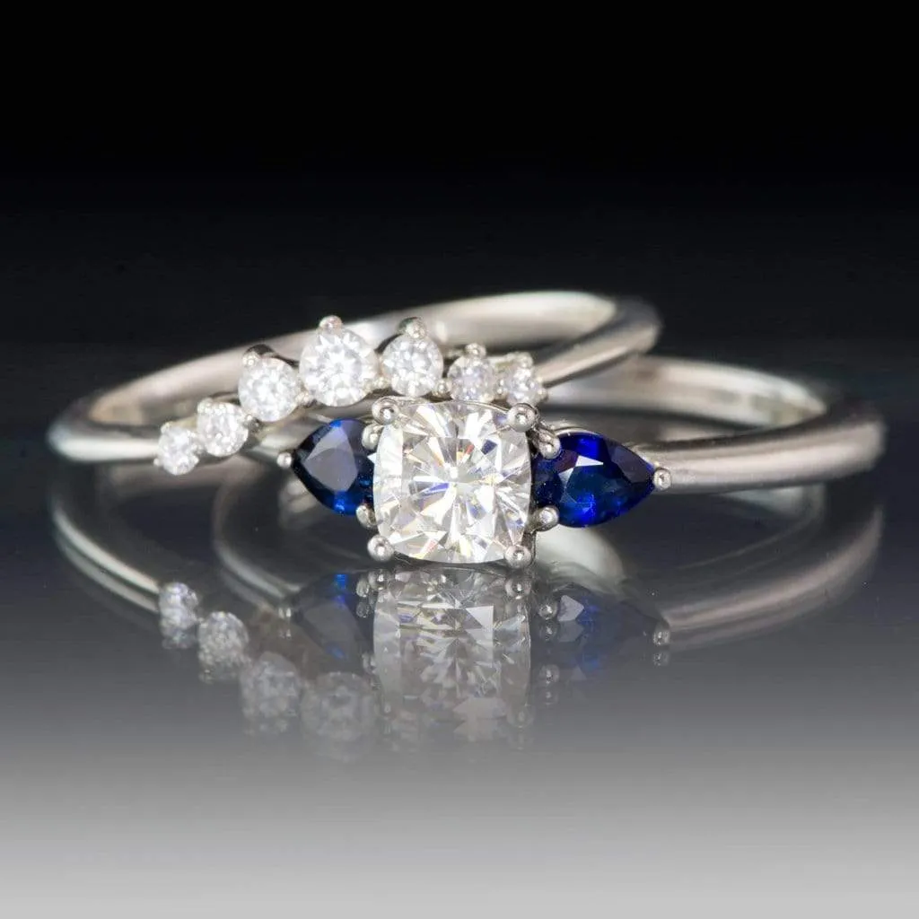 Tressa- Three Stone Engagement Ring, Prong set Cushion Moissanite & Pear Blue Sapphire Accents