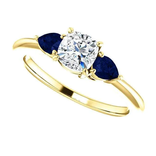 Tressa- Three Stone Engagement Ring, Prong set Cushion Moissanite & Pear Blue Sapphire Accents