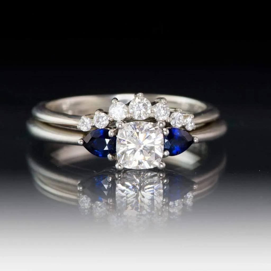 Tressa- Three Stone Engagement Ring, Prong set Cushion Moissanite & Pear Blue Sapphire Accents