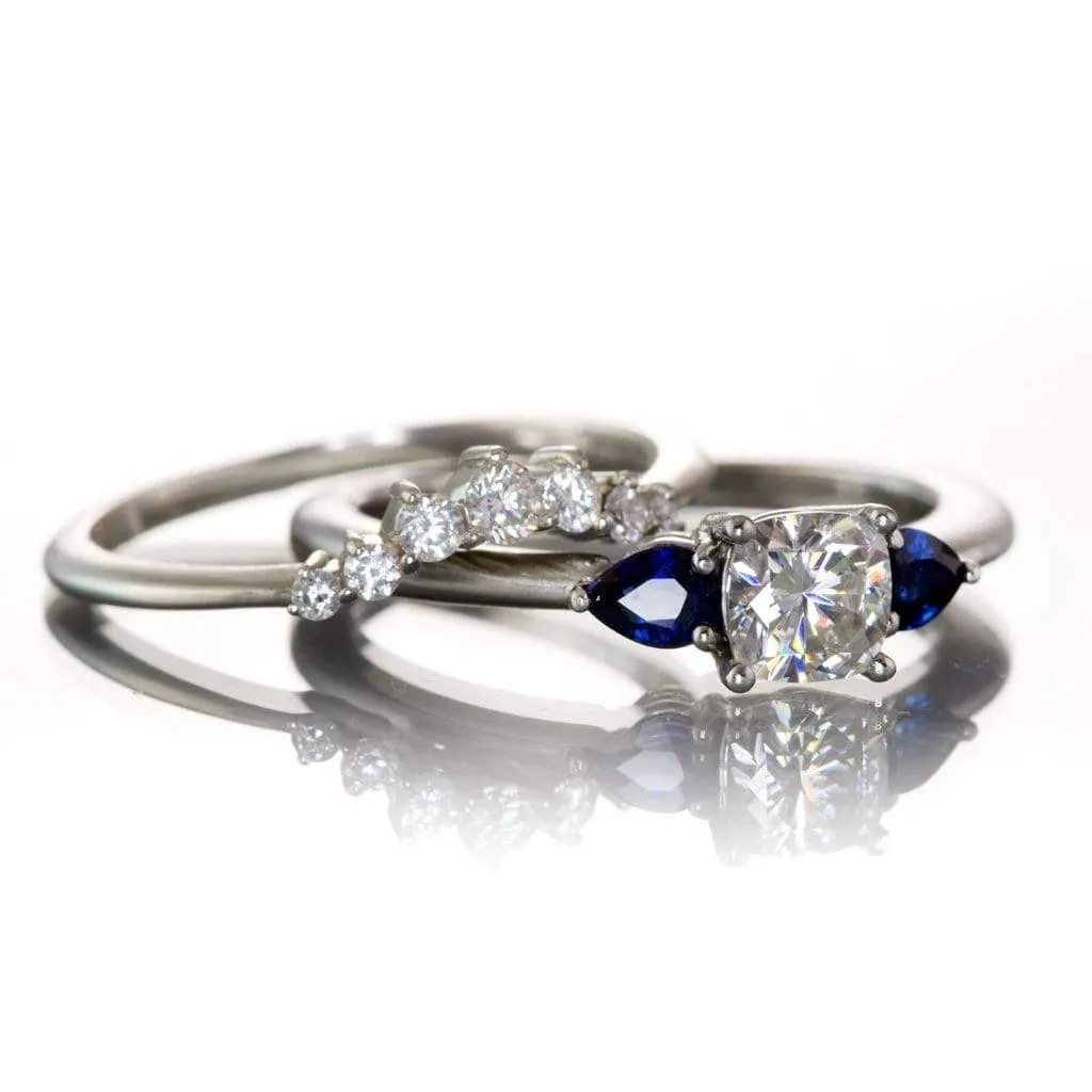 Tressa- Three Stone Engagement Ring, Prong set Cushion Moissanite & Pear Blue Sapphire Accents